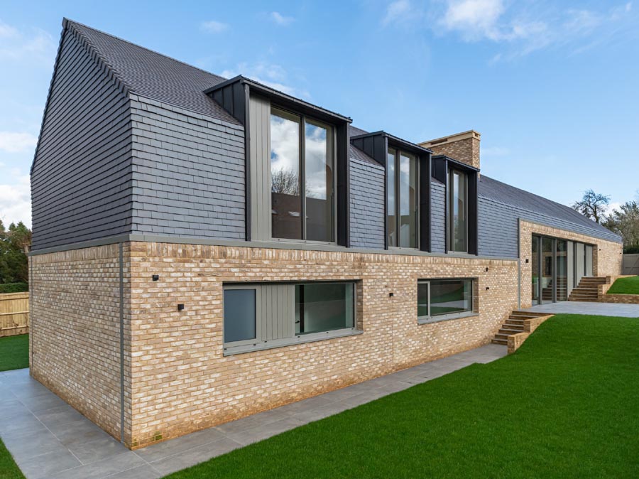 Staffs blue smooth tiles on contemporary newbuild by Sabatini Homes